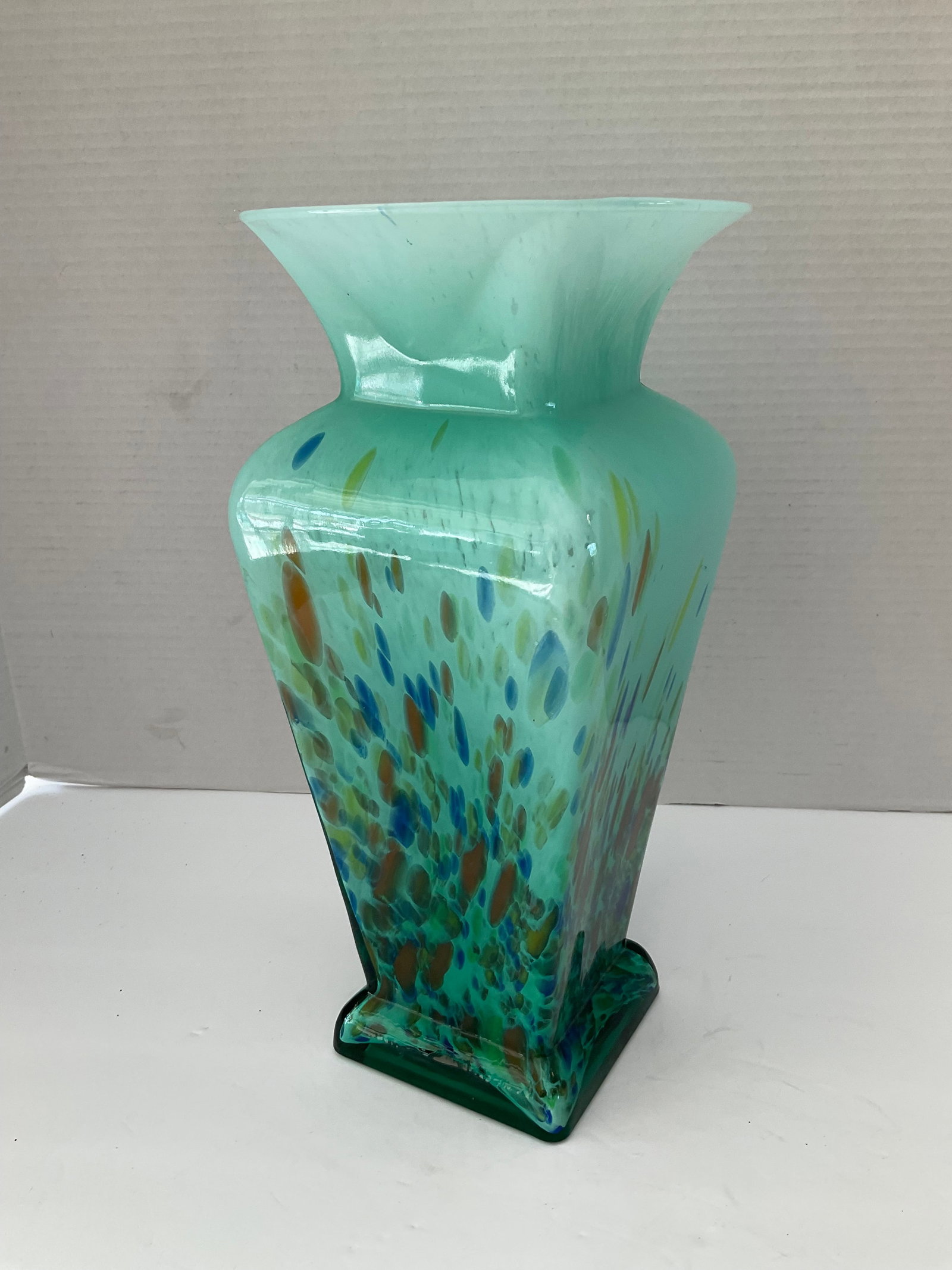 Multi Colored Green Art Glass Vase: A multi colored green glass art vase. This is a very colorful classical style art vase standing 13" in height with a 4 x 4 inch base and a 6.5" round top lip. Good condition