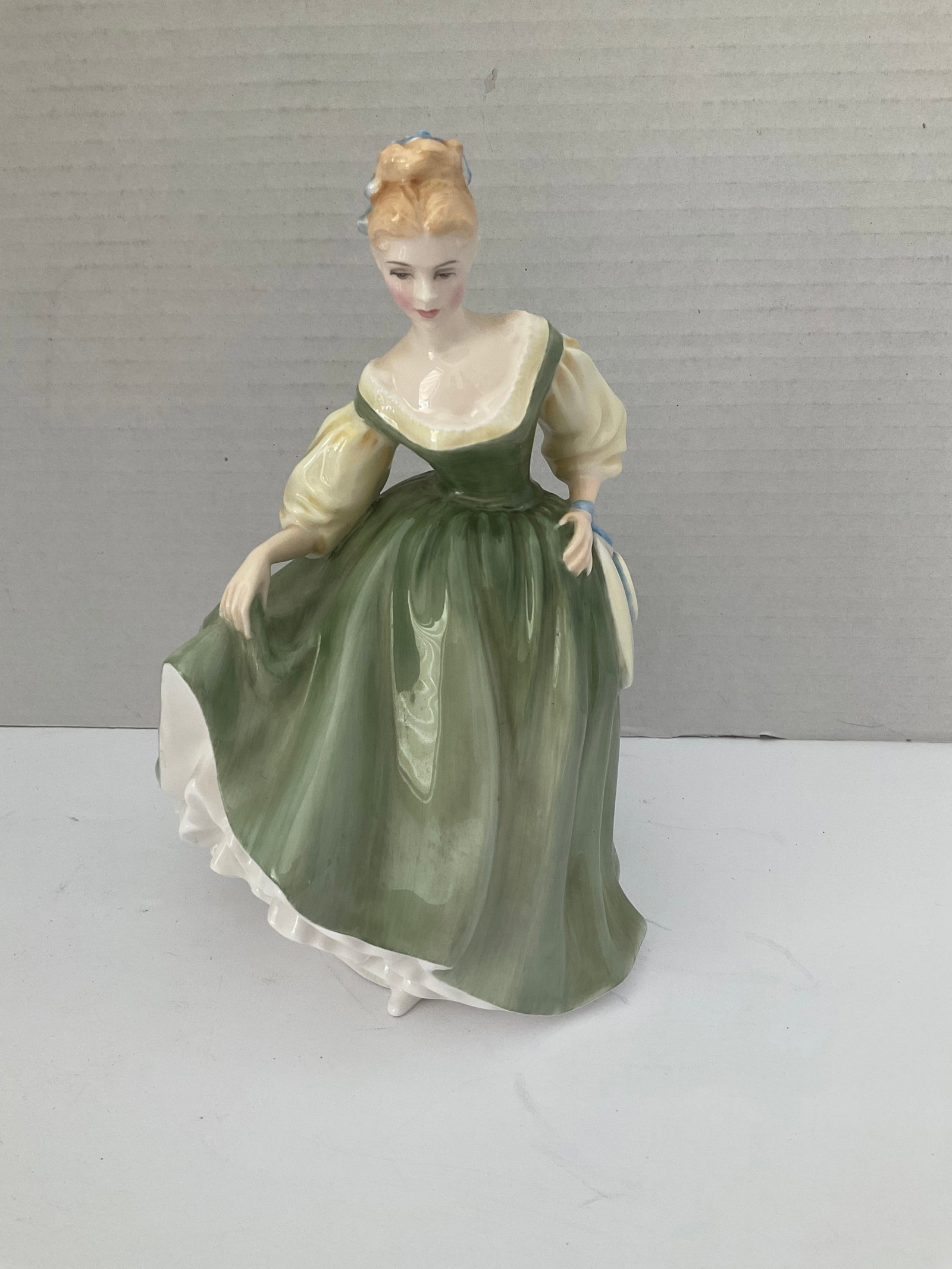 Royal Doulton 1962 "Fair Lady" Figurine: A Royal Doulton "Fair Lady" figurine. Dated 1962 and numbered 2193. Very good condition, it measures 7.5" x 5" in diameter.