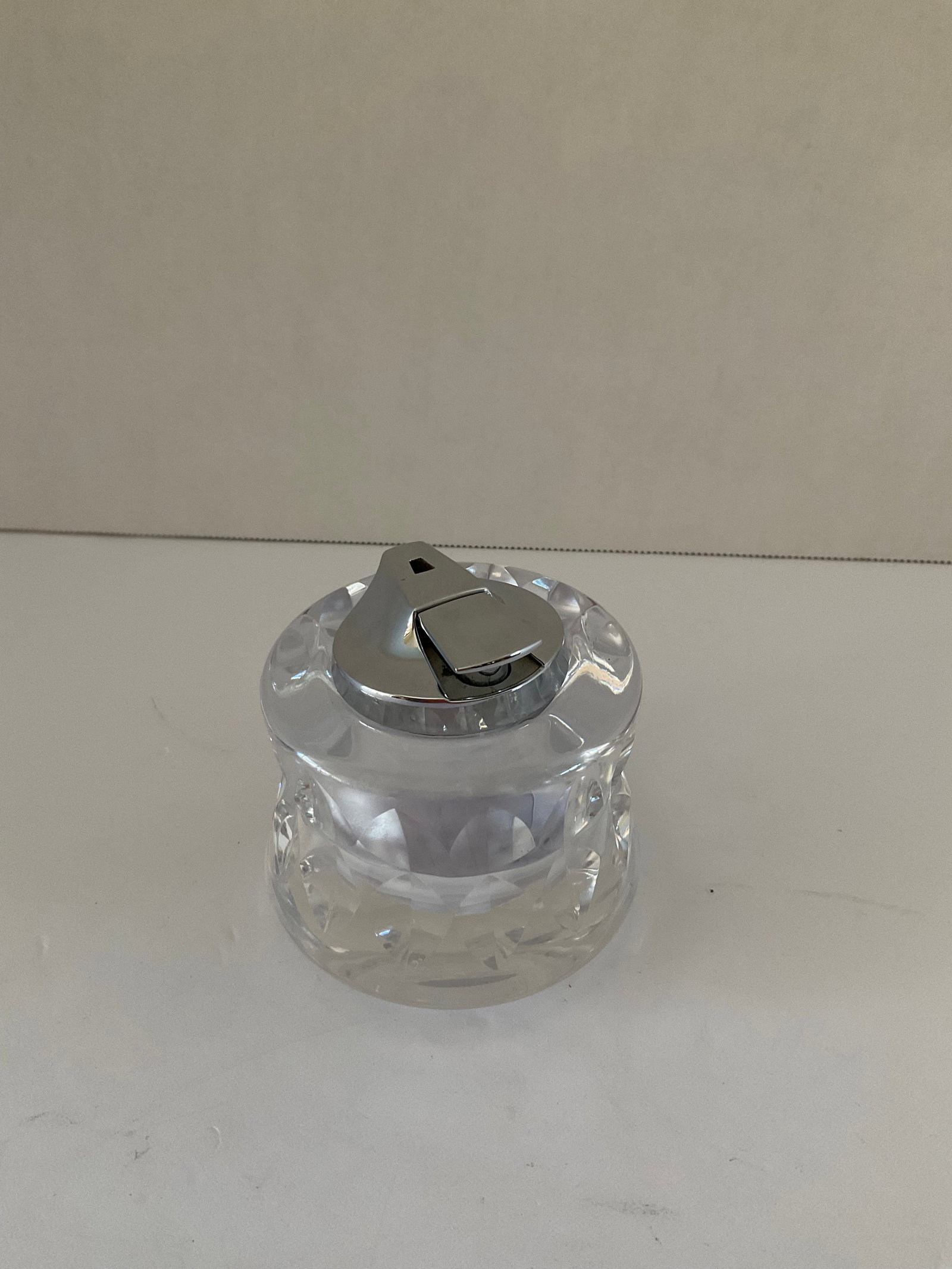 Kosta Boda Crystal Mid Century Lighter: A signed and numbered Goran Warff Kosta Boda crystal lighter. Lighter mechanism has not been tested, sold as is. Lighter is made by Ronson. The crystal holder is in excellent condition. The crystal ho