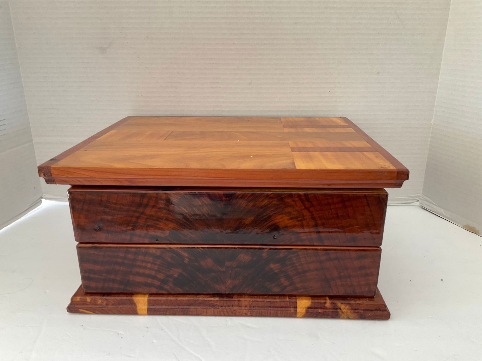 Handcrafted Wooden Jewelry or Storage Box: A beautiful handcrafted wooden box with two drawers and cedar interior. The interior has sliding small inside drawers. Very well made with a high lacquer finish. It measures 6"h x 12" x 10". Good cond