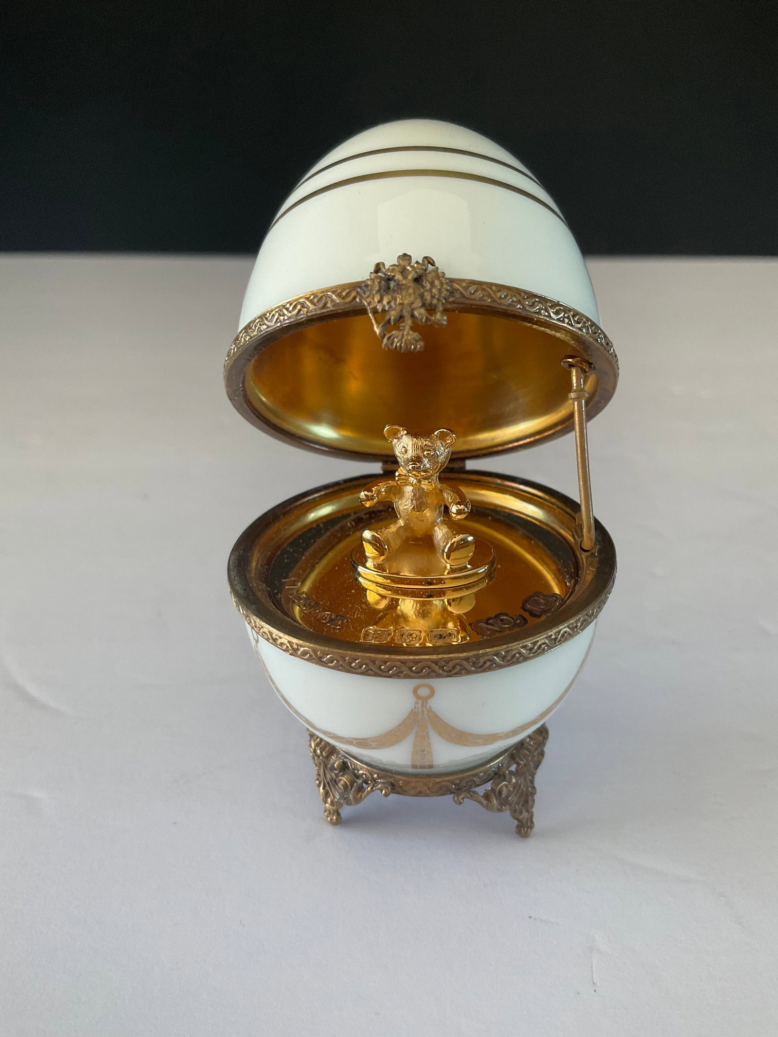 Antique Rare Faberge Limoges Limited Edition Egg: An antique rare Faberge Limoges Limited edition Egg. This piece has a gilded bear to the interior. It is number 151. No cracks or chips, minor wear to the metal adornments. It measures approximately 3
