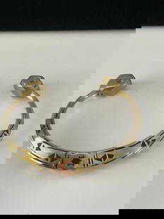 Heavy Sterling (?) Cuff Bracelet: A heavy handmade cuff bracelet with black accents. Made in the Mexican style, it is unmarked, but does not react with magnet. 3" in width it weighs 67 grams.