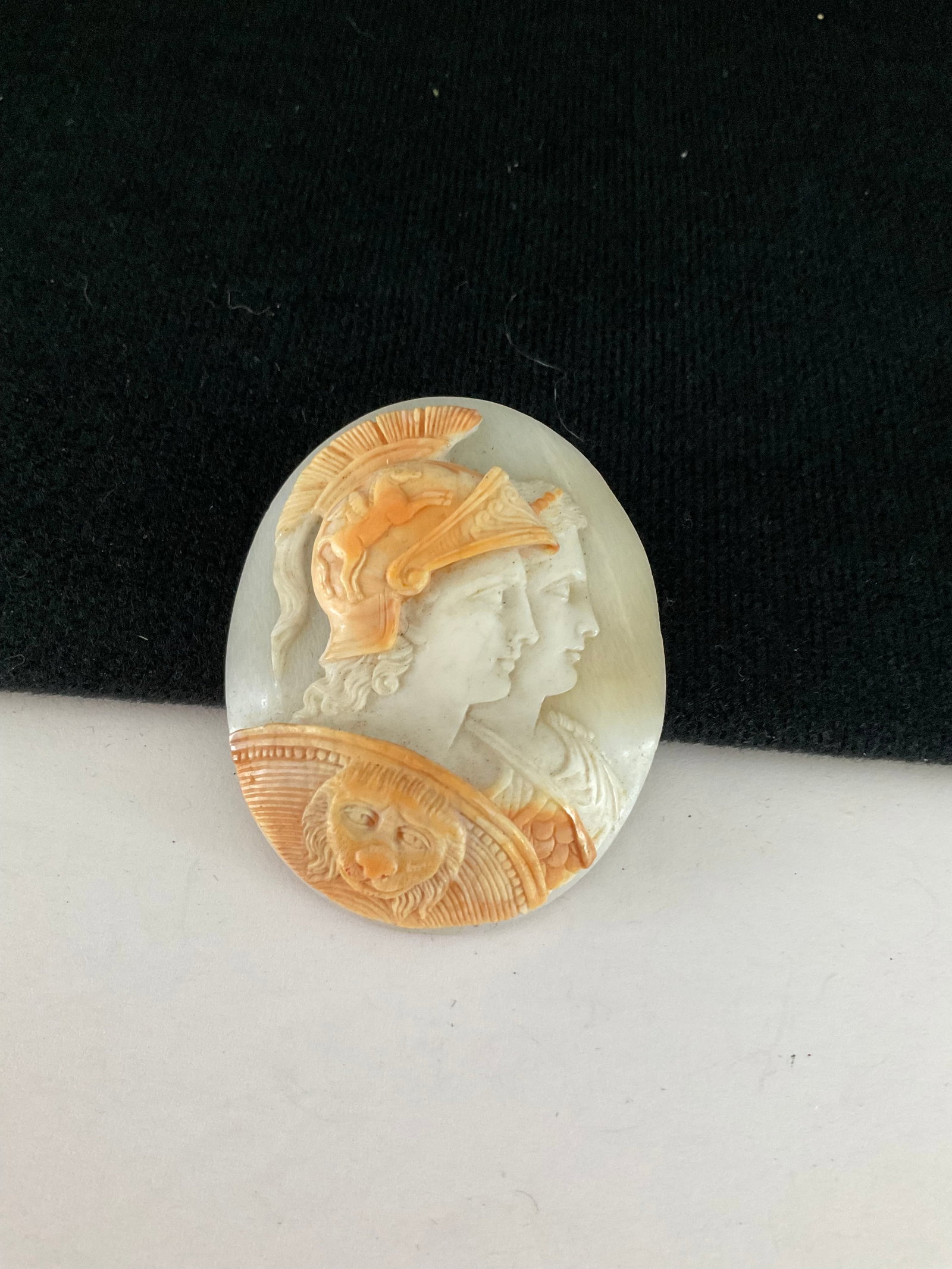 Unusual Neoclassical Carved Cameo: An unusual carved cameo featuring two Roman soldiers with a lion crested shield. This 2" x 1.75" piece is unset
