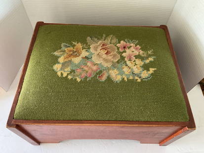 Mid century Needlepoint Stool: A small needlepoint stool with white painted base. The top is a floral needlepoint with a black background. It measures 8"h x 11" in diameter. Made in Vermont
