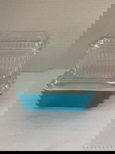 Two Vintage Refrigerator Containers: A blue Pyrex Rectangular Pyrex glass container with lid, 7" x 4". Also included is a square glass container with fruit on top.