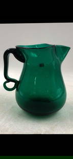 Blenko Emerald Green Vintage Pitcher: A vintage Blenko pitcher with unusual handle. It is 7.5"h x 6" x 8" . Please see photos