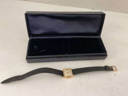 Vintage 14k Gold Tiffany & Co Wristwatch: A Tiffany & Co 14K 1950's Wristwatch. This piece has a 14k case and clasp and an embossed leather strap. The piece is not in working condition at this time. It has been taken to watch's repair - see p