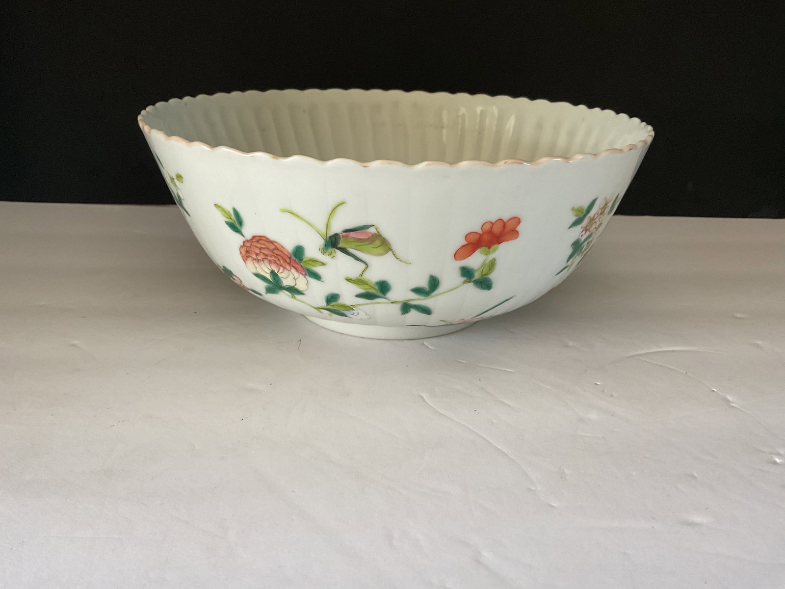 Antique 1910 Porcelain Chinese Bowl: A lovely Famille Rose Chinese porcelain dated to 1910. It is a beautiful piece, very delicate. It measures 3.5" h x 8" in diameter.