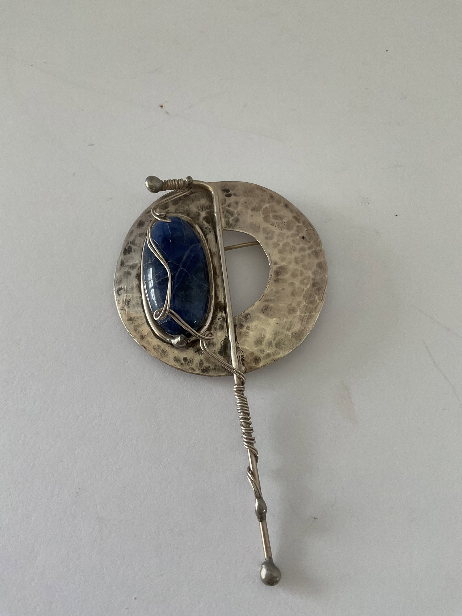 Handcrafted Sterling Silver and Lapas Brooch: This is a large handcrafted stamoed sterling silver and lapis brooch. It measures 4" x 2" and the weight inclusive of stone is 20.4 grams.