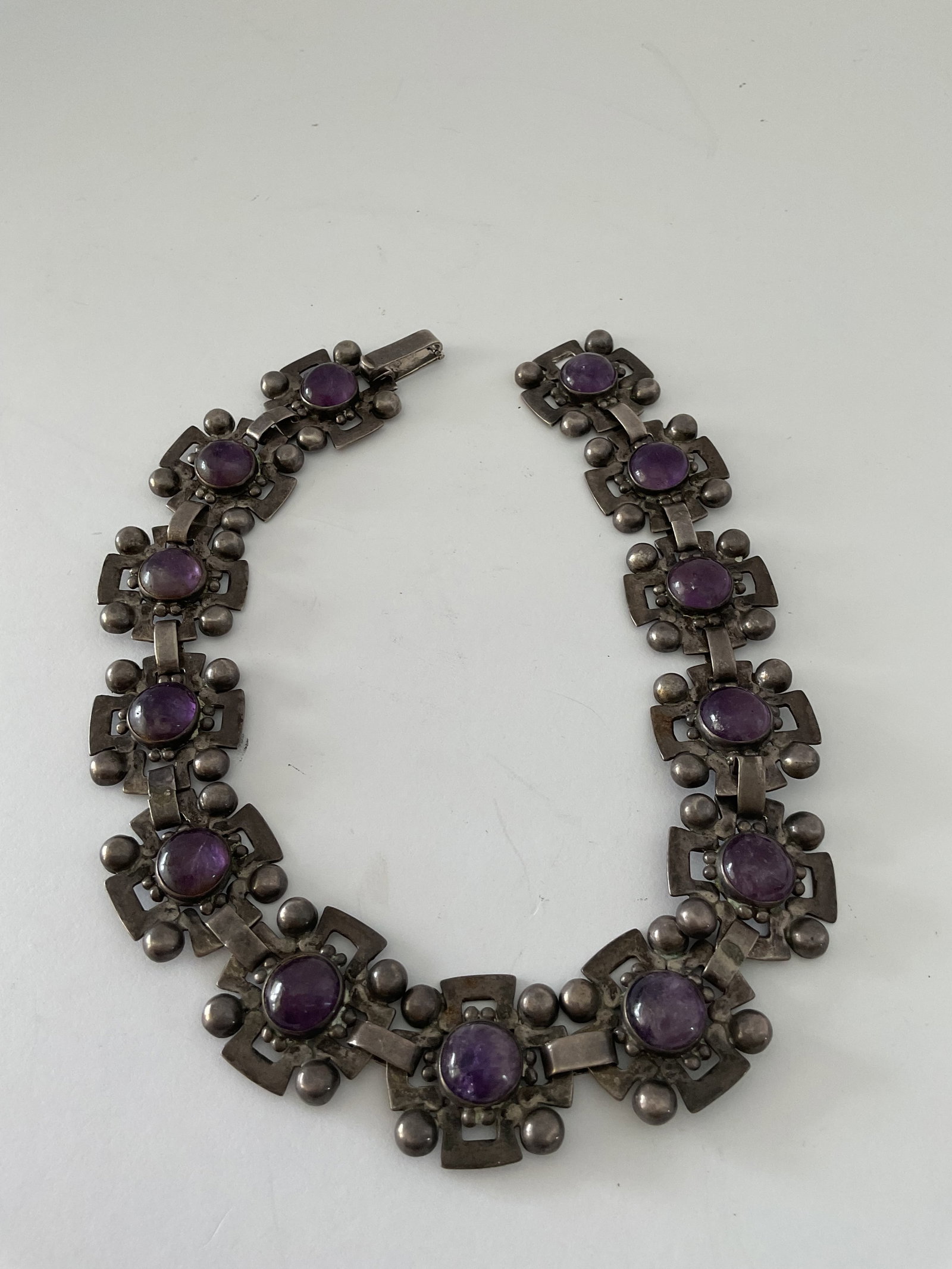 Vintage Sterling Silver and Amethyst Necklace Signed from Mexico: A vintage sterling silver necklace from Mexico. This piece is quite heavy at 93.8 grams and is 16" in length. It is signed (see photos) and stamped. Some wear to the links consistent with age.