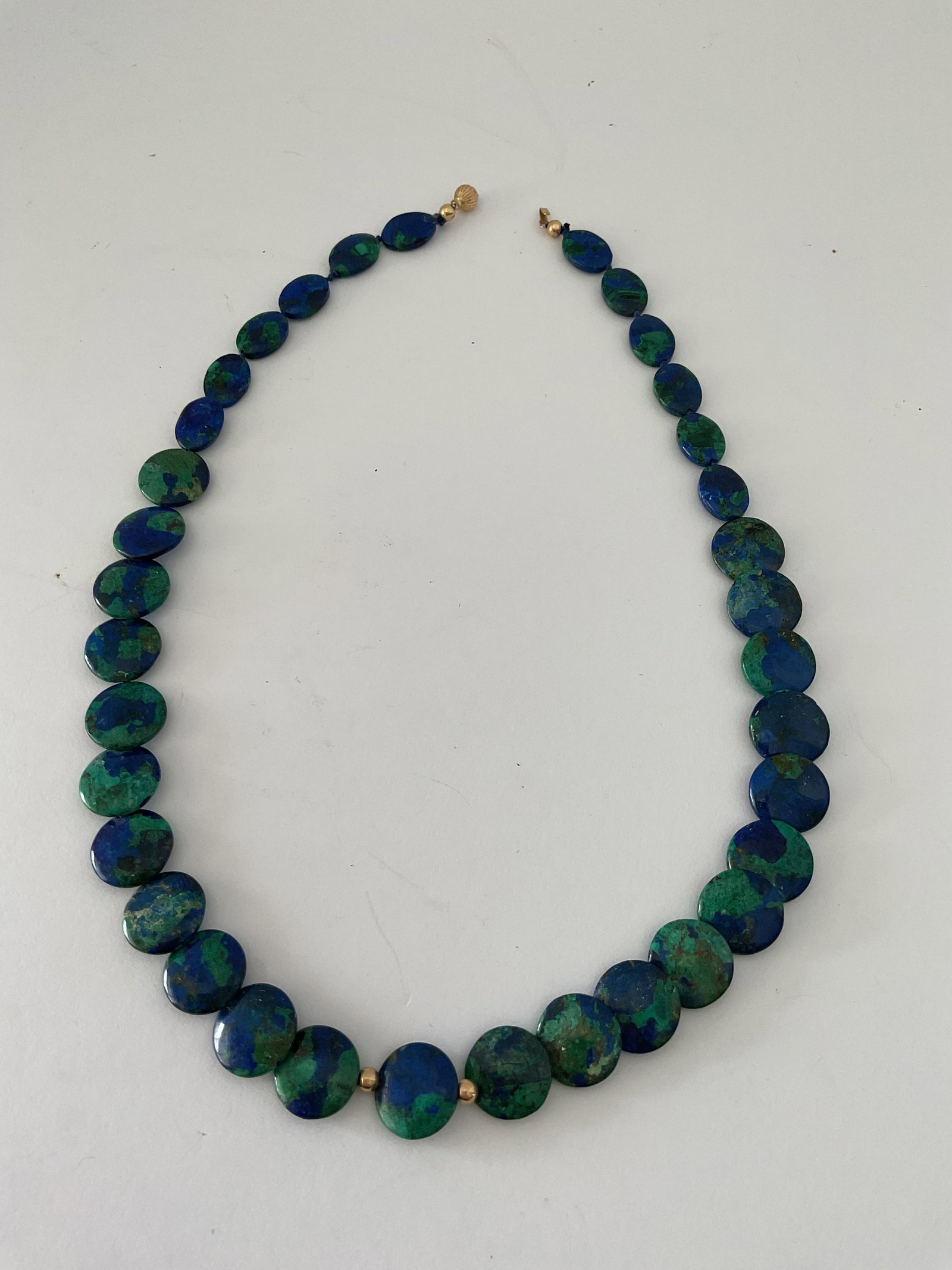Rare Azurite and Malachite Necklace with 14K Clasp and Beads: A 19" necklace with rare azurite/malachite beads. the piece is accented with a 14K yellow gold clasp and beads.