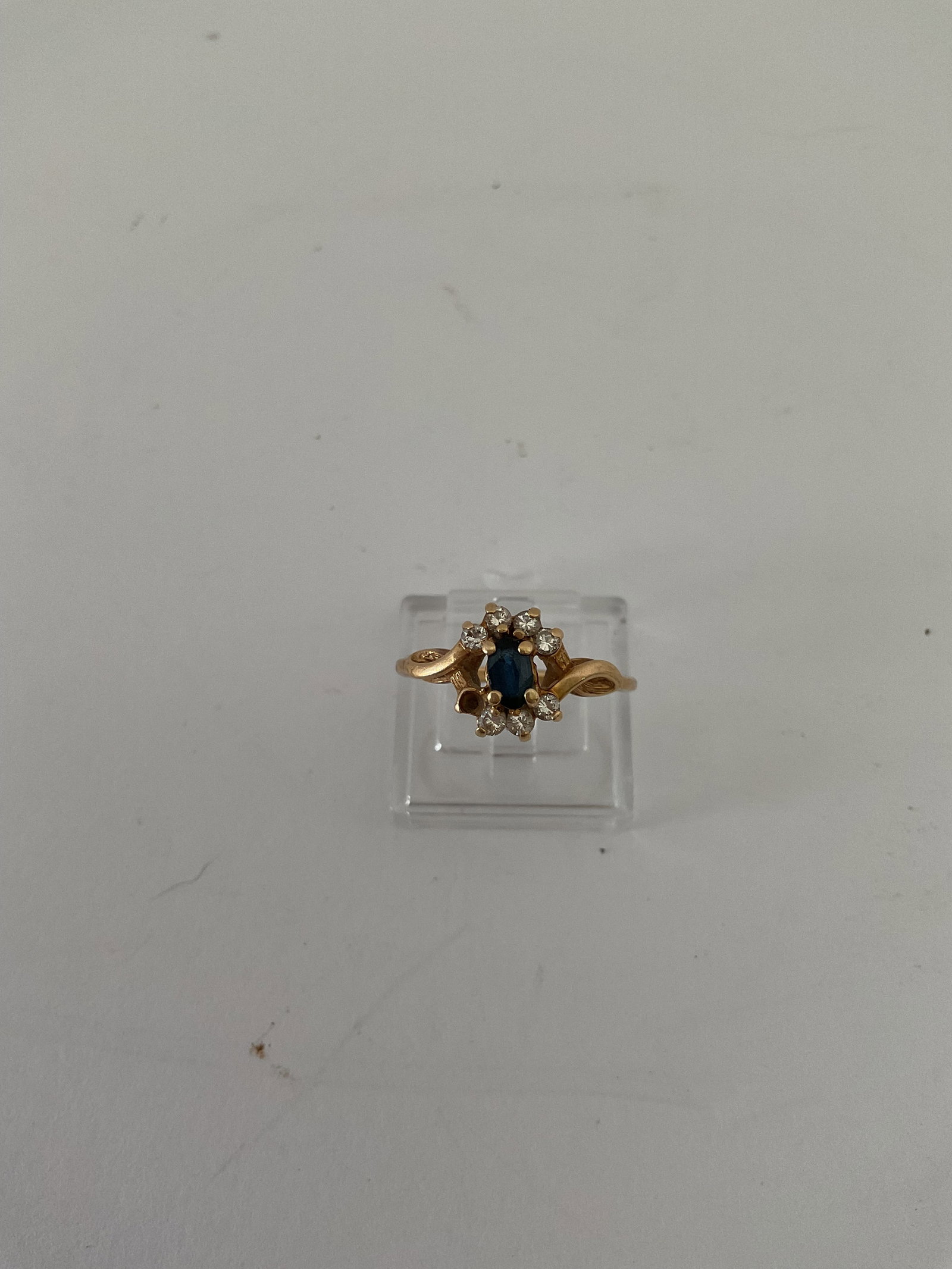 14K Yellow Gold Size 6 Ring with crystals and Deep Blue Stone: A size 6 ladies 14K yellow golld ring with stones. Missing one stone. Weight is 2.2 grams.