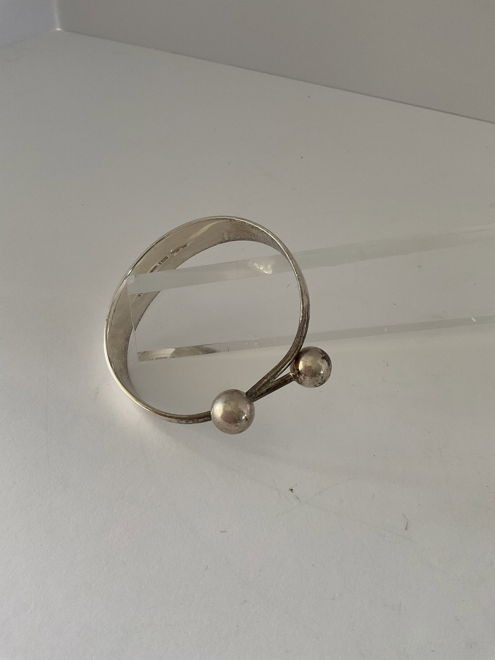 Danish Hans Hansen Sterling Silver Bracelet: A vintage mid century Danish adjustable bangle bracelet. Designed by Hans Hansen. the weight is 42.1 grams, signed to the inside.