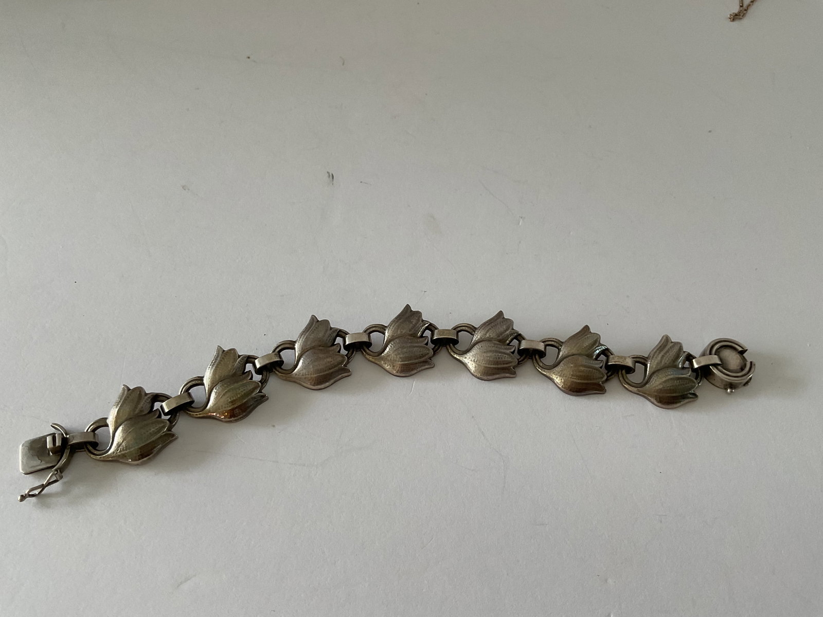 Georg Jensen Classic Sterling Tulip Bracelet: A mid century Georg Jensen sterling tulip bracelet. Signed and numbered 100B. 7.5" in length, weight is 27.6 grams