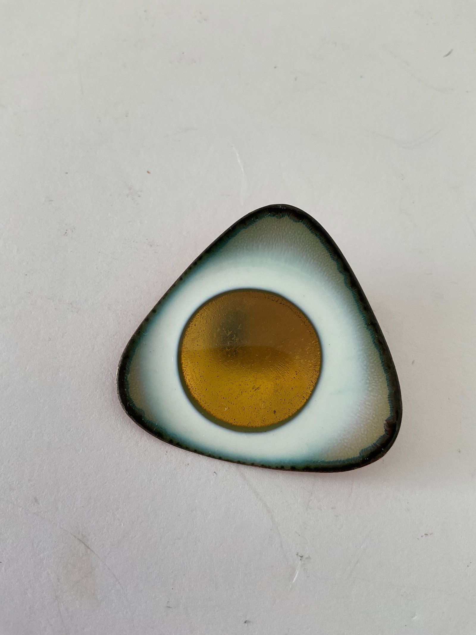 Hogan Bolas Mid 20th Century Copper and Enamel Brooch: A vintage mid century Hogan Bolas modernist copper and enamel brooch. It measures approximately 1 x 1"