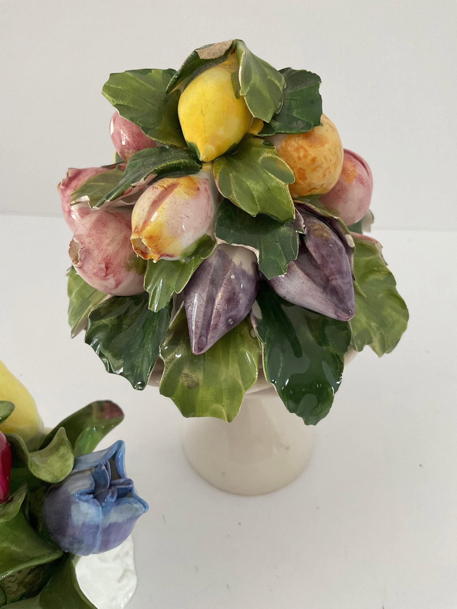 Capodimonte Baskets: Two Capodimonte figurines. One is a pedestal basket from Italy and the other is English Aynsley. Both are antique with some missing petals. Please see photos. The larger is 6 x 4”, small Aynsley