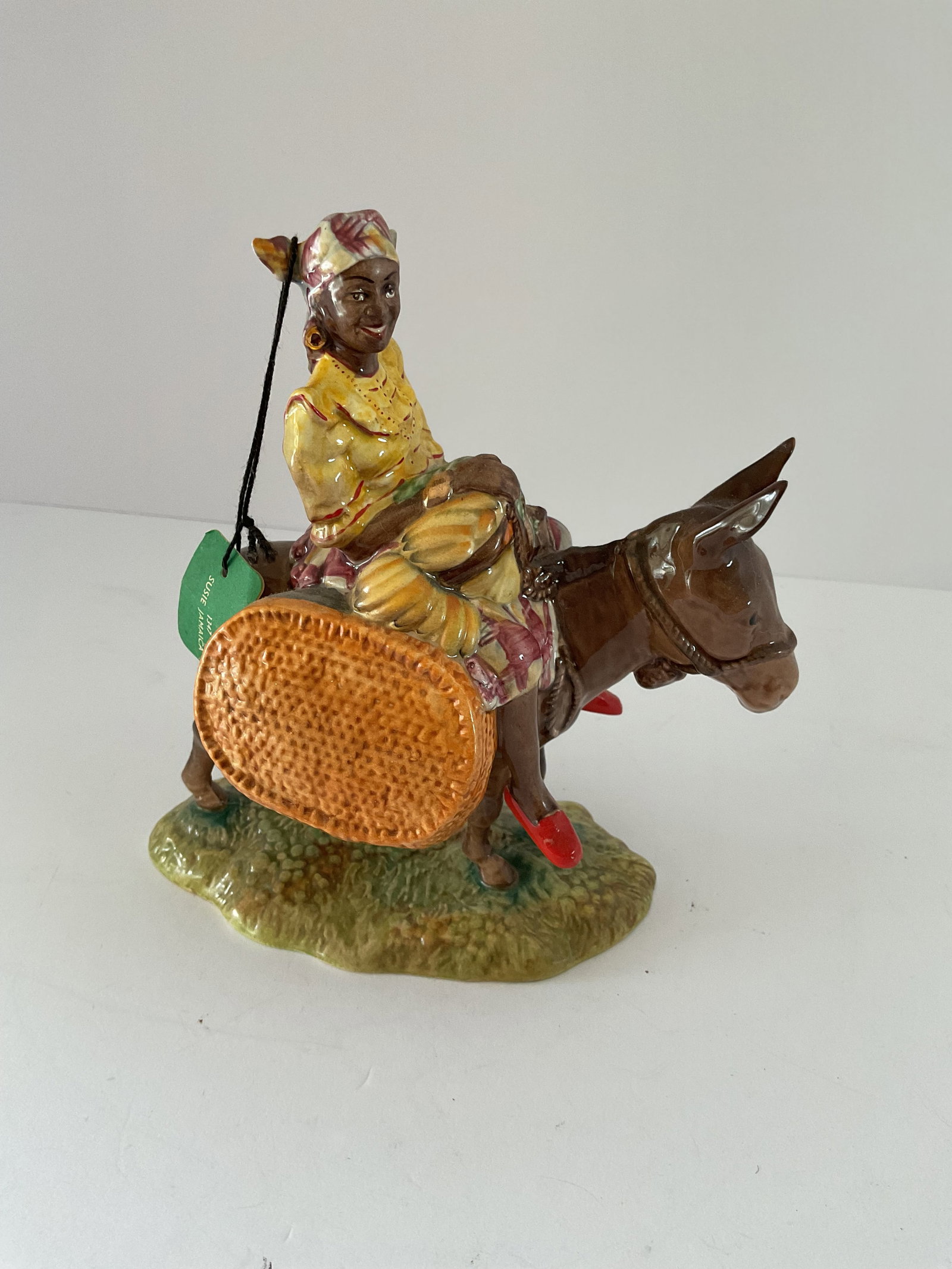 Rare Mid Century Beswick “Susie Jamaica”: A mid century figurine titled “Susie, Jamaica”. Comes with the original tag. Clearly backstamped. It is number 1347. It measures 6” x 7.5