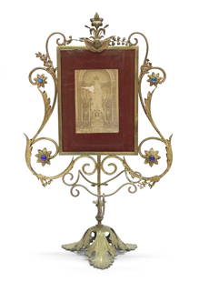 French Photo Stand In Gilt Brass: H: 50 cmFrench photo stand in gilt brass, decorated with coloured glass stones, decorated with cherub to central top.