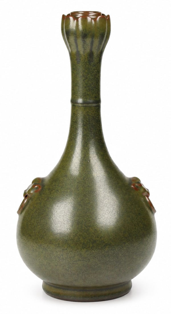 A teadust-glazed 'lotus-mouth' vase with pushou mask handles: Dimensions: Height 33.5 cm. Description: Elegantly proportioned, the vase features a pear-shaped body supported on a short foot, rising along a slender neck to a distinctive mouth molded in the shape