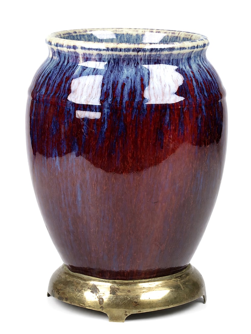 A large 'flambé'-glazed jar (zun) with gilt-bronze base: Dimensions: Height 23 cm. Description: The massive, heavily potted vessel features a deeply rounded ovoid body that curves gently inwards to a short, ribbed neck and an inverted, thickened rim. The