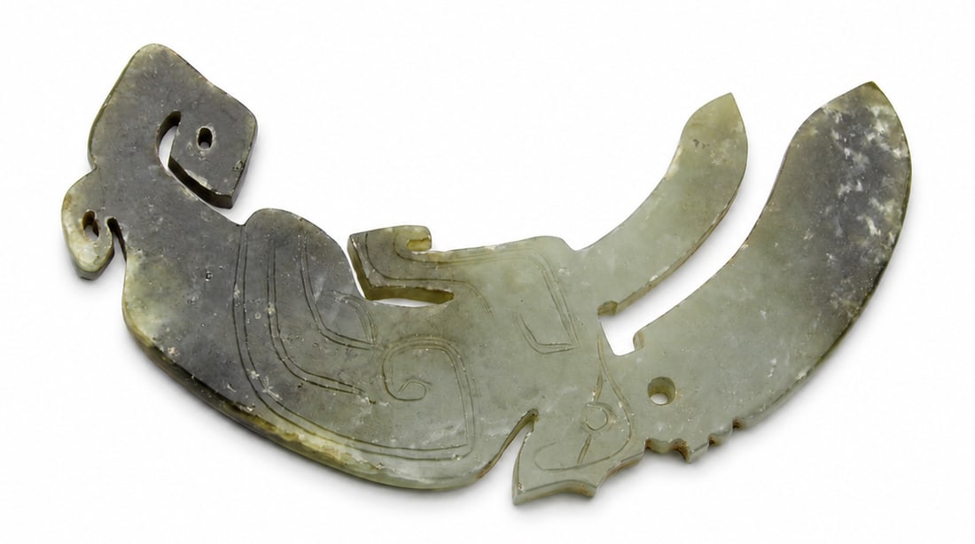 Carved Jade Dragon/Bird Pendant (Huang): Dimensions: Length 8.3 cm, Description: An arched, crescent-shaped jade pendant featuring stylized, openwork carvings. One end tapers into an abstracted, hooked bird or dragon head with an open