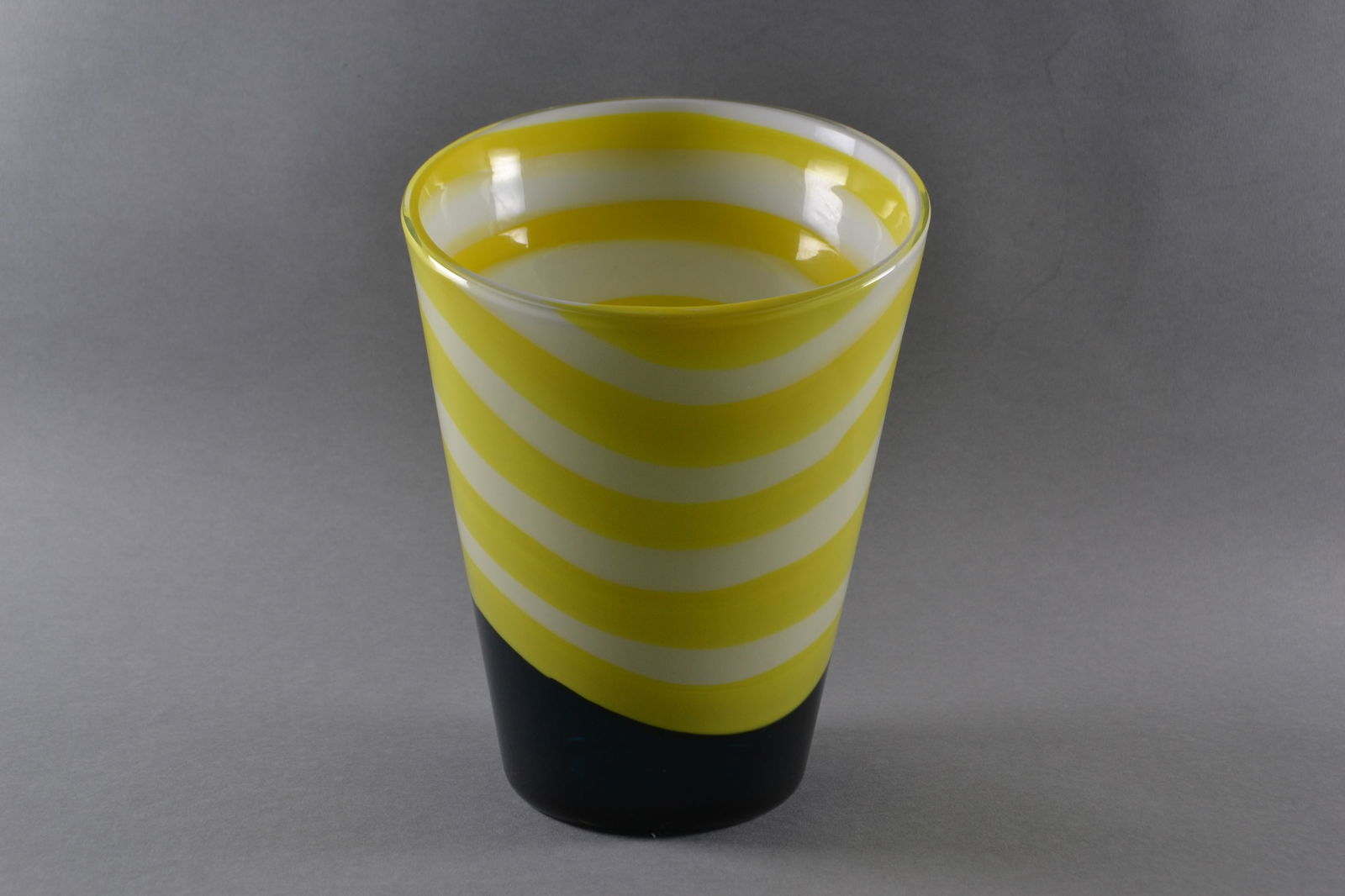 Gianni Versace (Italian 1946-1997) For Venini, Asimmetrico Vase, 1998: Cased and cut glass in yellow black and white, signed and dated (at base): Venini Gianni Versace, H: 9", w: 6 1/2", d: 7" (at mouth), 4" (at base)