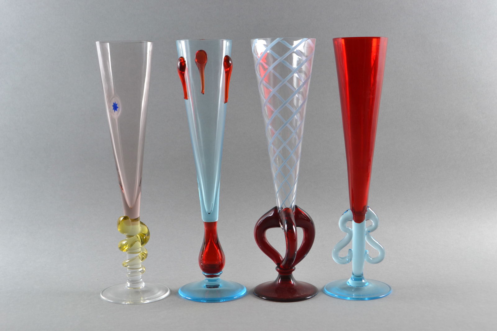 Carlo Moretti (Italian, 1934-2008), Italian Murano Art Glass Champagne Flutes, 1992 -1998 (4): each signed and dated on top of base , H: 10 3/4"