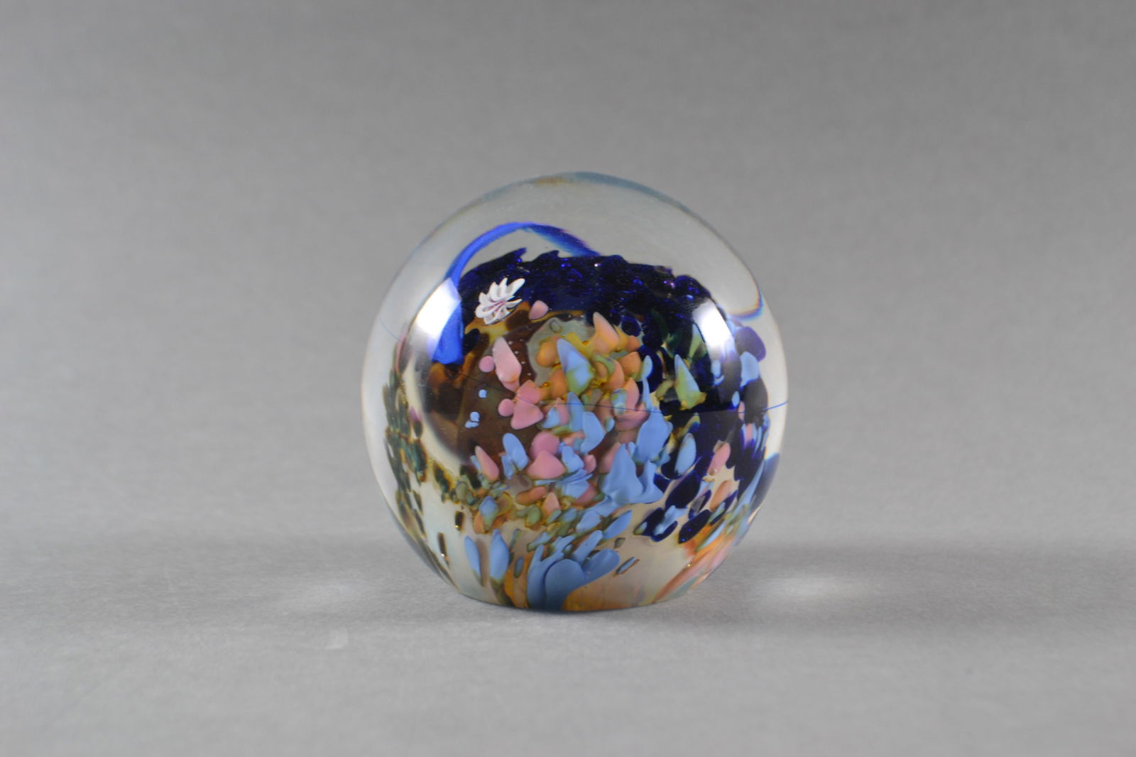 Josh Simpson (American), Planets Series Art Glass Paperweight, 1985: Ocean motifs and colors, signed Simpson, numbered and dated at base, H: 3"