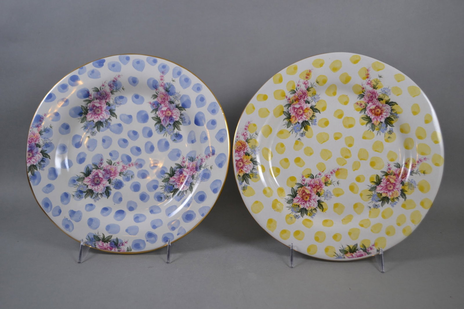 Mackenzie Childs Terracotta Dinner Plates,1989-1993: Blue - Dia.: 11 5/8 inchesYellow - Dia.: 11 7/8 inchesBoth are stamped on back Victoria and Richard Mackenzie - Childs LTD 1993 with artist identification stamp R and H respectively