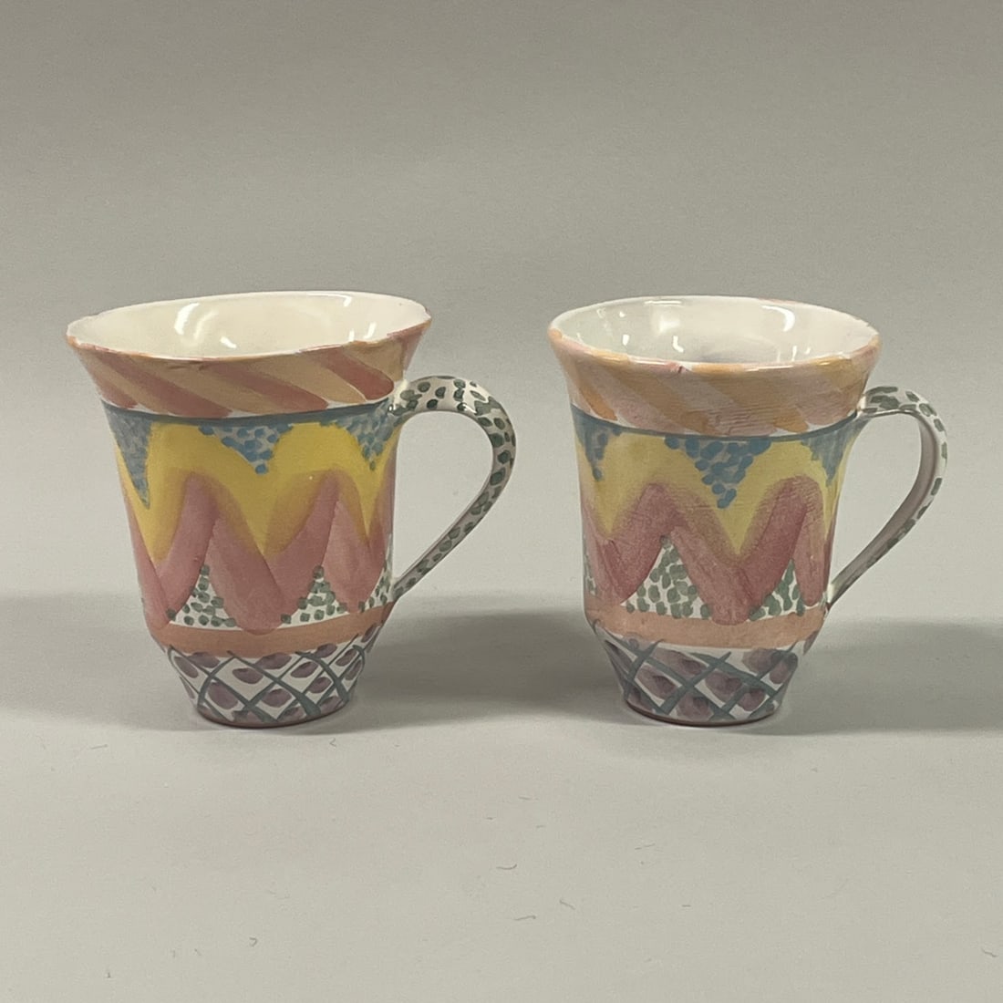 Two Mackenzie Childs Keukenhof Mugs: H: 4 3/4 x 4 1/2 x d: 4 inchesCONDITION: excellent