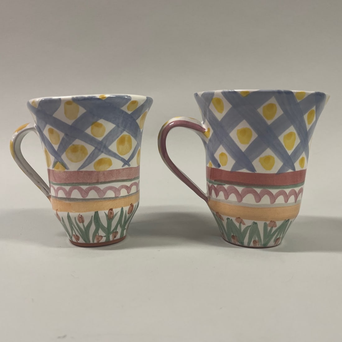 Two Mackenzie Childs Aalsmeer Mugs: H: 5 x w: 6 x d: 4 1/2 inchesCONDITION: excellent