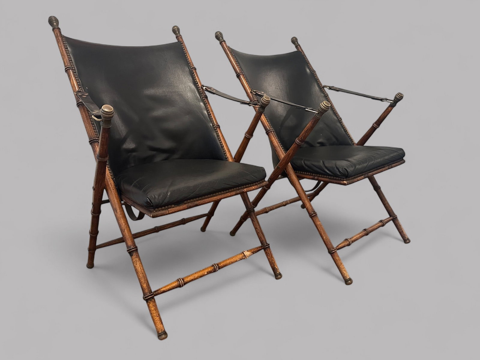 Pair Of Italian Faux Bamboo Campaign Chairs, Circa 1950: H: 37 3/4 x w: 20 1/2 x d: 30 inchesSeat height from floor: 16 3/4 inches