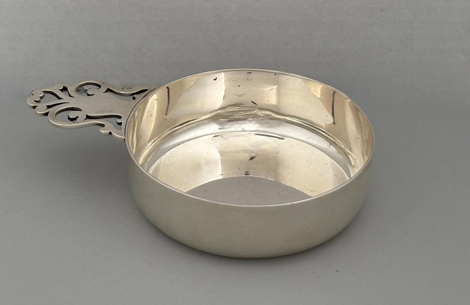 Tiffany & Co. Sterling Silver Hollowware Porringer, Mid-late 20th Century: Hallmark and numbered 5796/sterling/925h: 1 1/2 x w: 6 1/2 x d: 4 1/2 inches (inclusive of handle)7.45 OZT