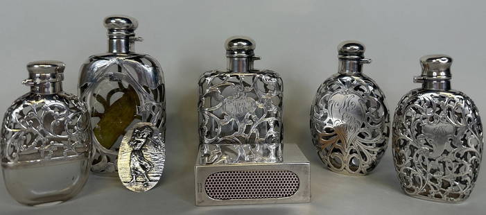 Collection Of Sterling Silver Overlay Glass Flasks (5) With A Matchbox Holder, C. Early 20th Century: Four are stamped/hallmarked at foot neck or hinge monogrammed; largest: H: 5 inches smallest: H: 3 3/4 inches; matchbox holder: W: 3 1/4 x d: 2 inches weighable OZT: 3.5