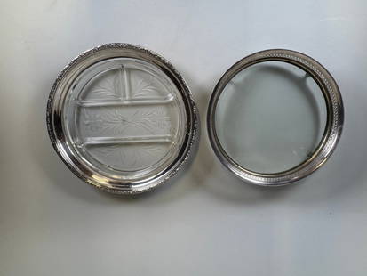 Two Silver And Glass Round Serving Trays: Etched glass divided tray - dia: 12 inches; punched and beaded rim tray - hallmarked (indecipherable) and raised on four hairy paw feet - dia: 10 inches
