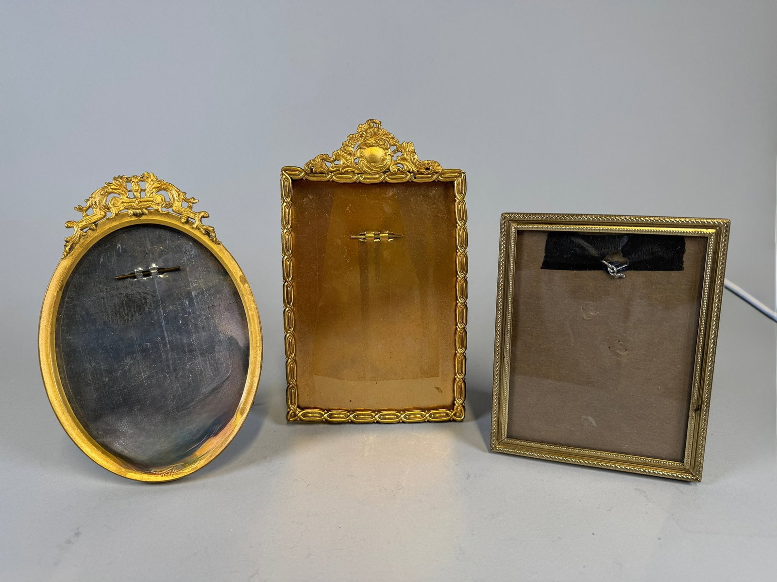 Three Gilt-metal Picture Frames: H: 7 x w: 4 3/8 inches
