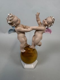 Putti Atop A Gold Ball Porcelain Figurine, Germany, Wallendorf/Hutschenreuther