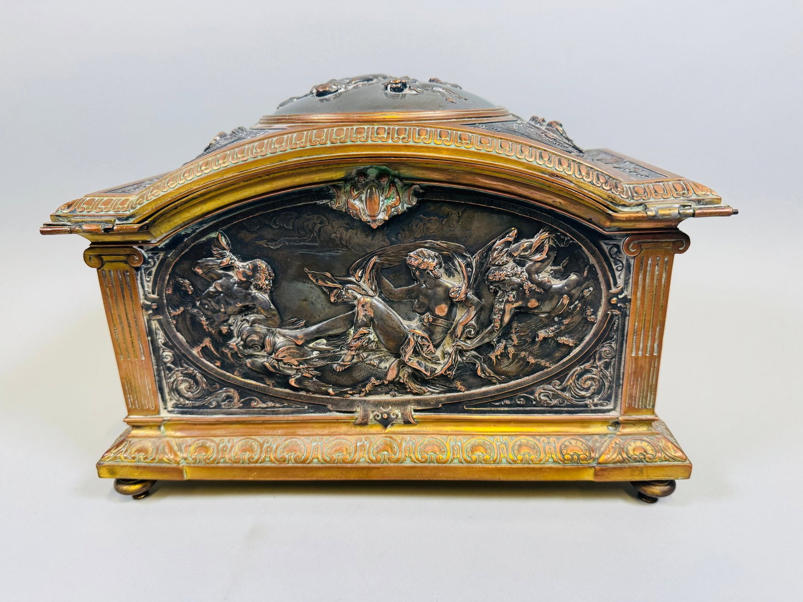 French Bronze And Repousee Jewelry Casket, 19th Century: Each panel with silver over copper scenes from Roman mythology blue velvet lining with functional lock and key unmarked h: 7 3/4 x w: 11 x d: 6 inches CONDITION: interior velvet lining appears to have