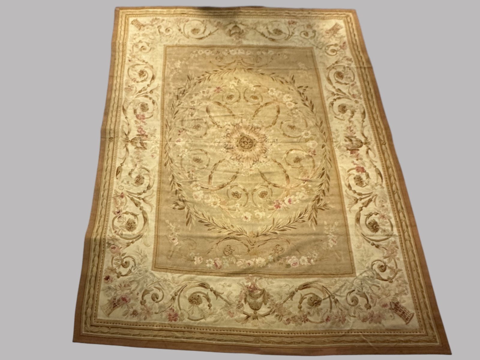 Antique French Aubusson Rug: 13' 1/2 x 9' 4 ft.CONDITION: Areas of wear splits and repairs throughout colors are faded