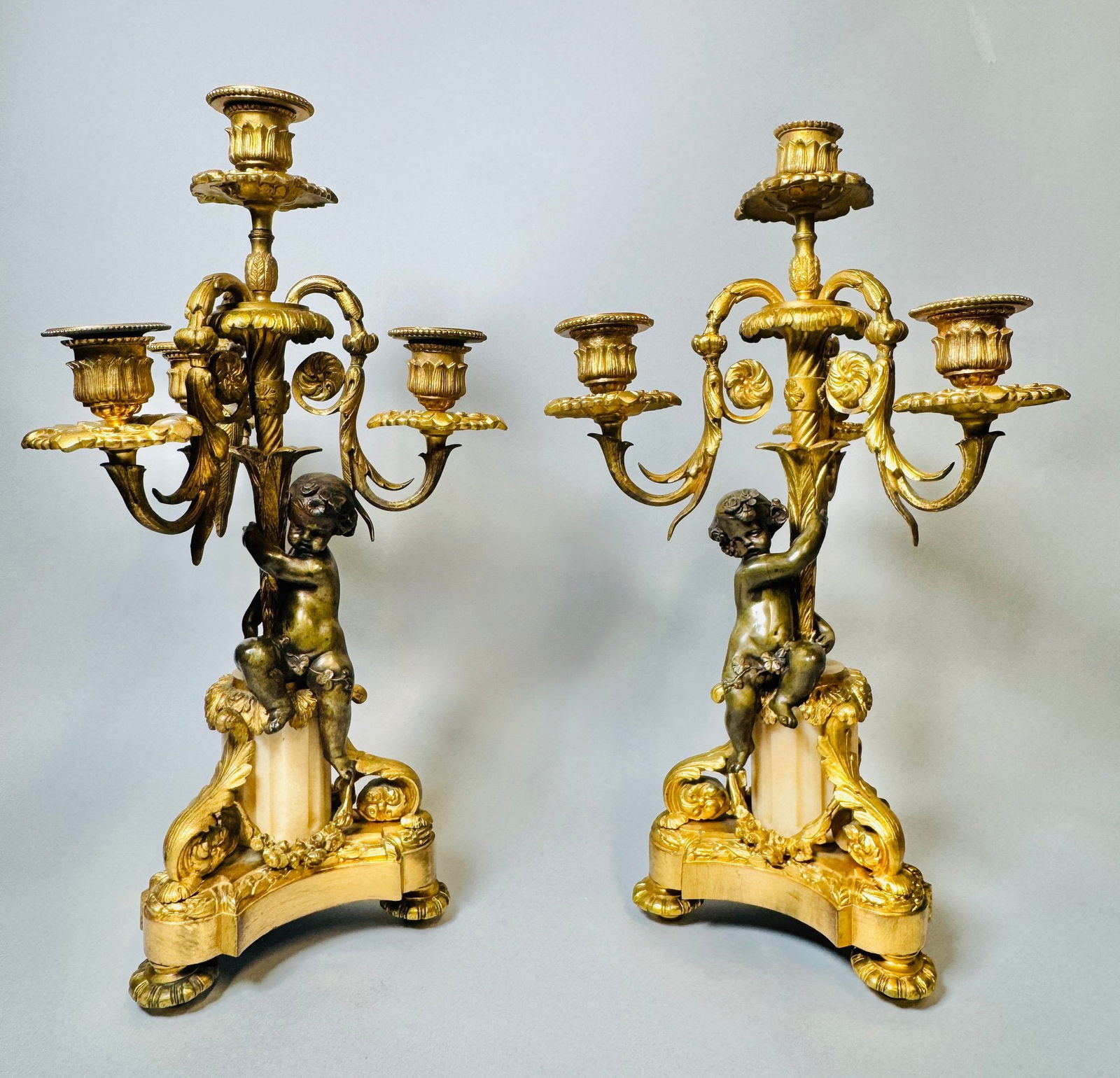 Pair Of Louis XVI Style Gilt Bronze And Alabaster Four-Light Candelabra, Late 19th Century: unsigned Height: 15 1/8 inches