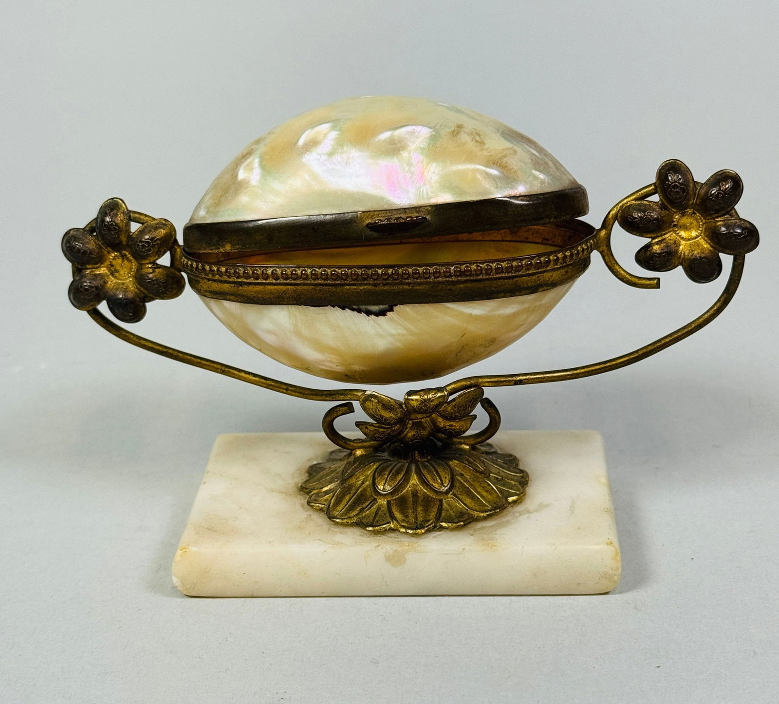 Brass And Shell Mounted Base, Early 20th Century: atop a rectangular marble base H: 3 1/4 inches