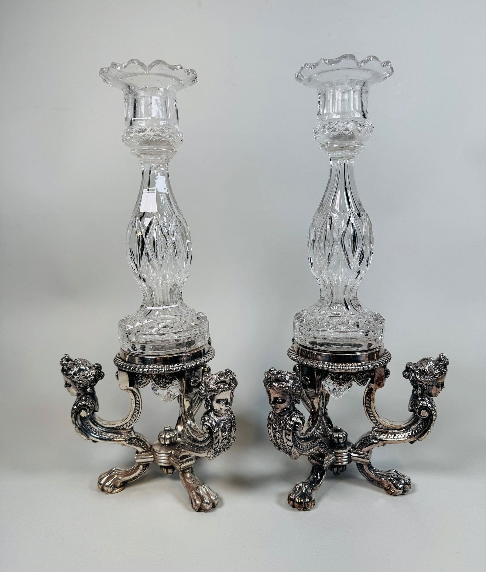 Pair Of Pairpoint Crystal And Silver Plated Neoclassical Style Candlesticks (2): signed to underside of bases #C6183 Height overall: 12 1/4 inchesCONDITION: very shallow flake to rim of one candlestick