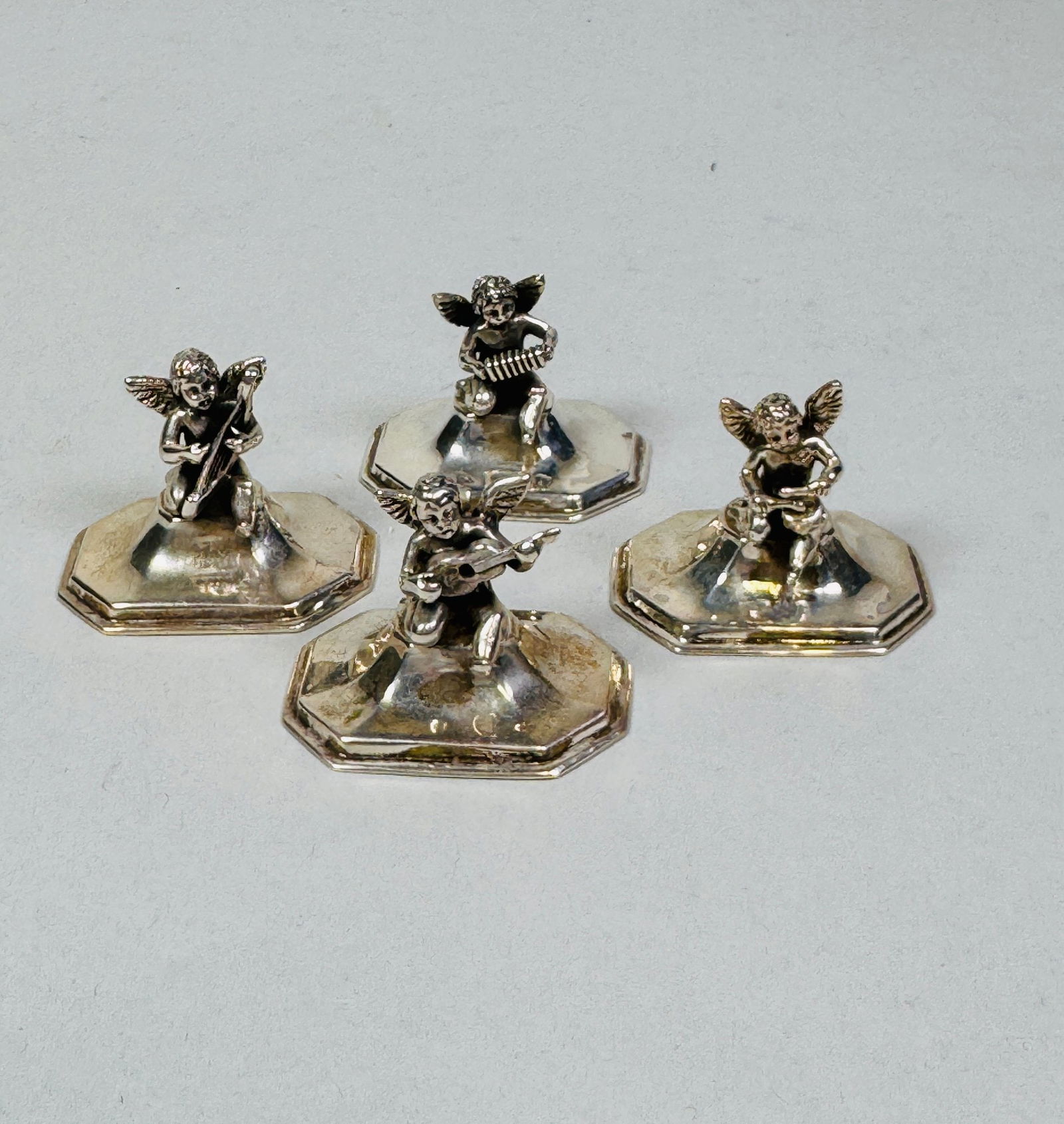 Four Sterling Silver Angel Weights (4): stamped STERLING/925 to underside of each H: 1 1/4 inches OZT: 4.37