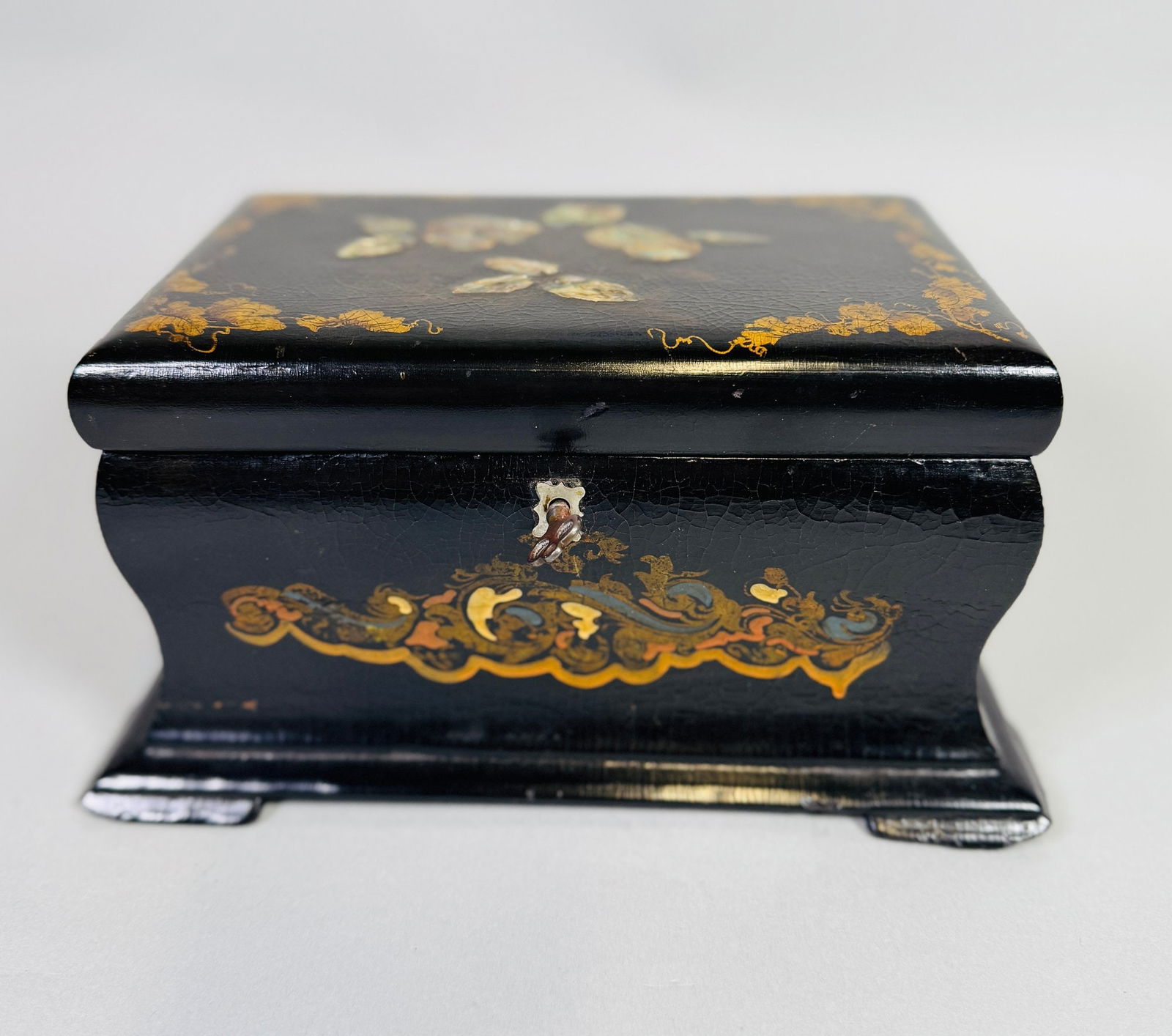 English Tunbridge Ware Shell Inlaid And Gilt Painted Tea Caddy, 19th Century: with key compartments with lids H: 4 3/4 x W: 9 x D: 6 inchesCONDITION: chips to two feet