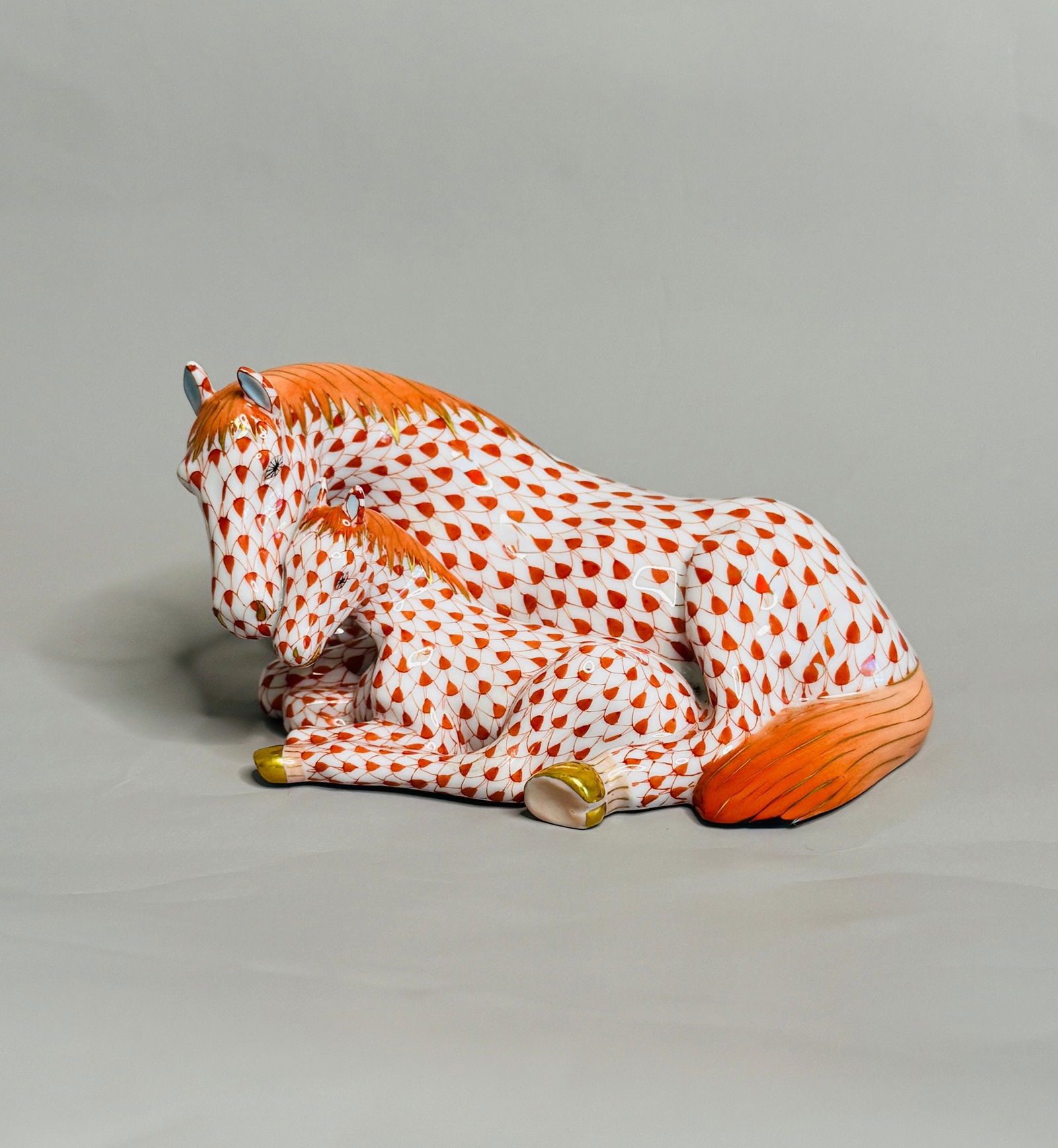 Herend Orange Netted Mare And Foal Figurine: stamped at underside, H: 2 3/4 x w: 5 x d: 3 inches. CONDITION: excellent
