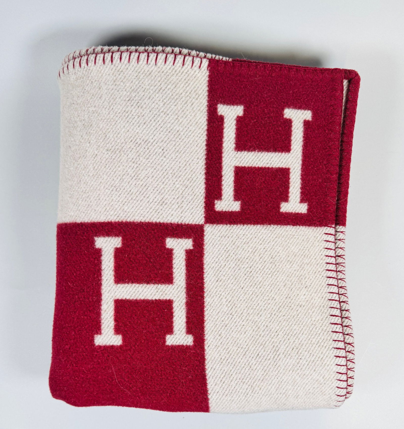 Hermes Avalon Burgundy Wool Cashmere Throw Blanket: 64 1/4 x 53 inches. CONDITION: does not come with box, Hermes label/tag removed; there are intermittent areas of thinning from use.