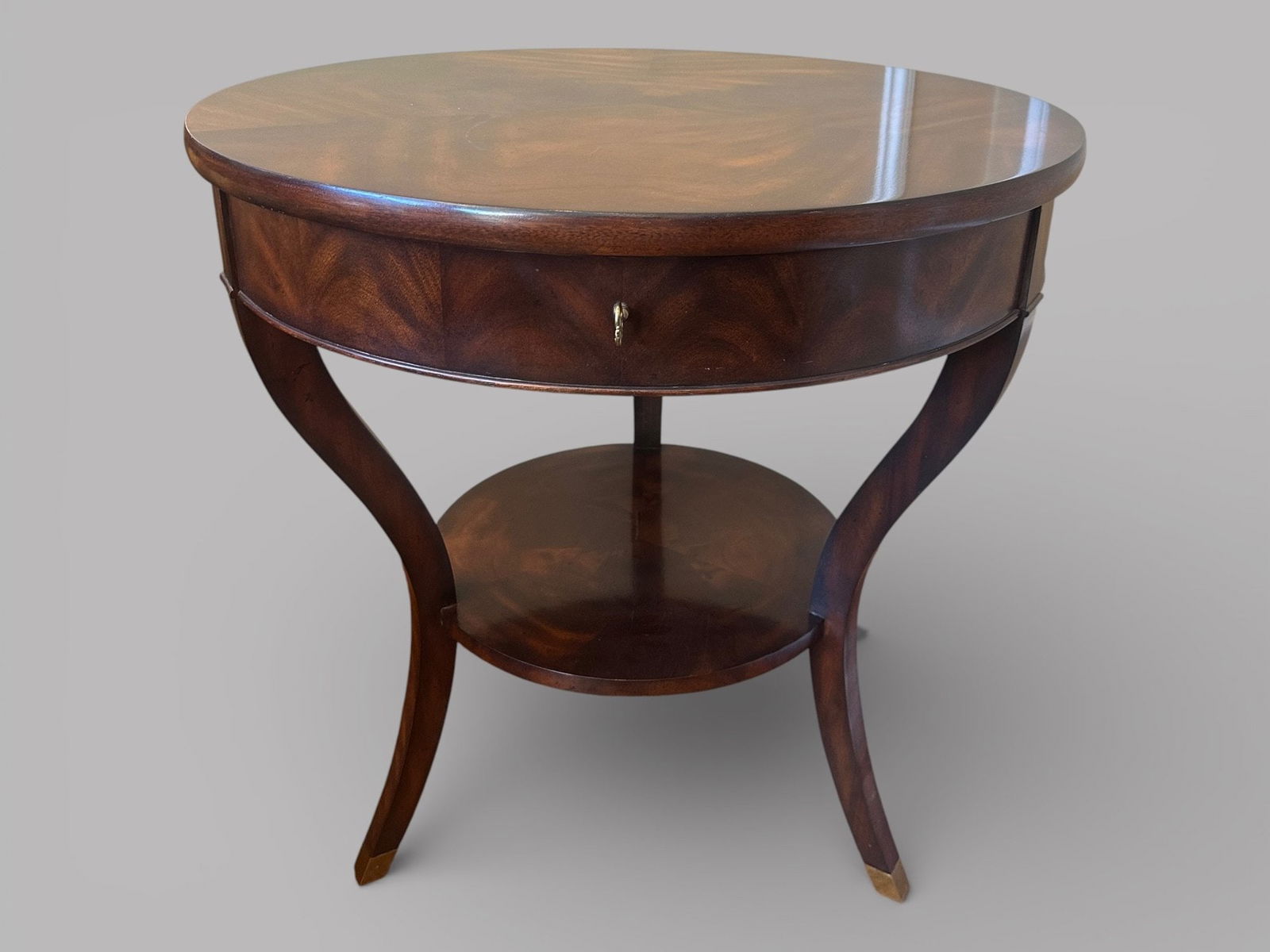 Ralph Lauren Noble Mahogany Veneered Round Side Table: having brass capped feet H: 30 1/2 x dia.: 30 inches