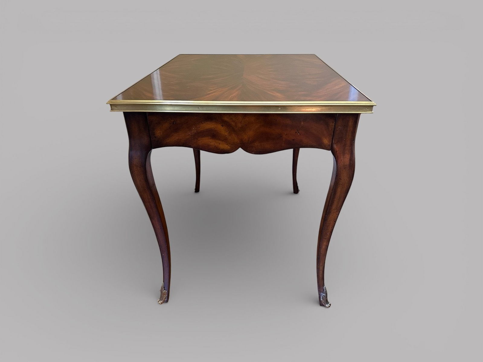 Ralph Lauren Noble Estate Mahogany Veneer And Brass Mounted End Table: having a hidden drawer at the front veneered crotch mahogany top H: 29 1/2 x w: 25 d: 31 1/4 inches