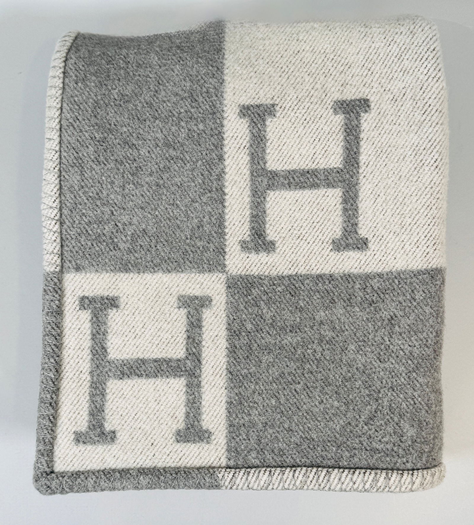 Hermes White And Charcoal Grey Avalon Throw Blanket: H: 63 x w: 50 inches85 percent wool 15 percent cashmereMade in Great Britain