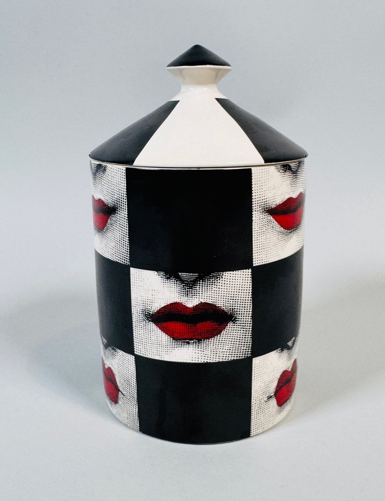 Fornasetti Profumi Labbra Otto Scented Candle 300 Grams: H: 6 x d: 3 1/2 inchesCONDITION: Chips missing from handle and lip of lid